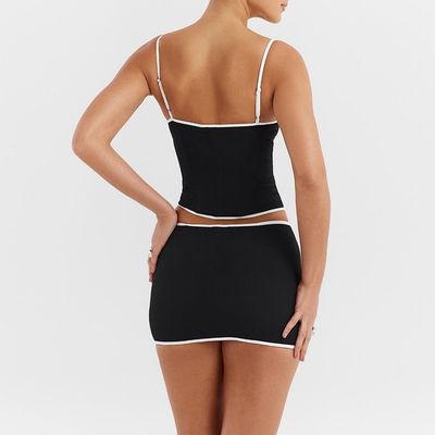 Nuovo contrasto di colori personalizzato gonna hollow con giubbotto abito di moda in due pezzi